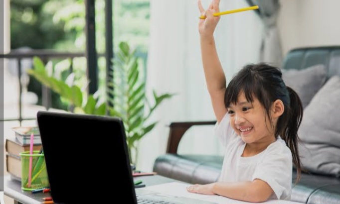 Student raising hand in class