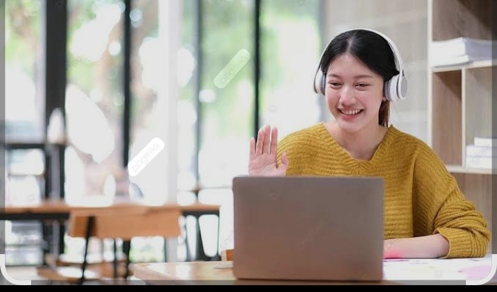 Student waving hello